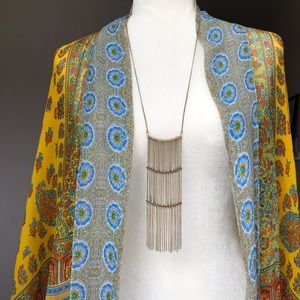 Gold coloured necklace, sexy 70’s, boho chic